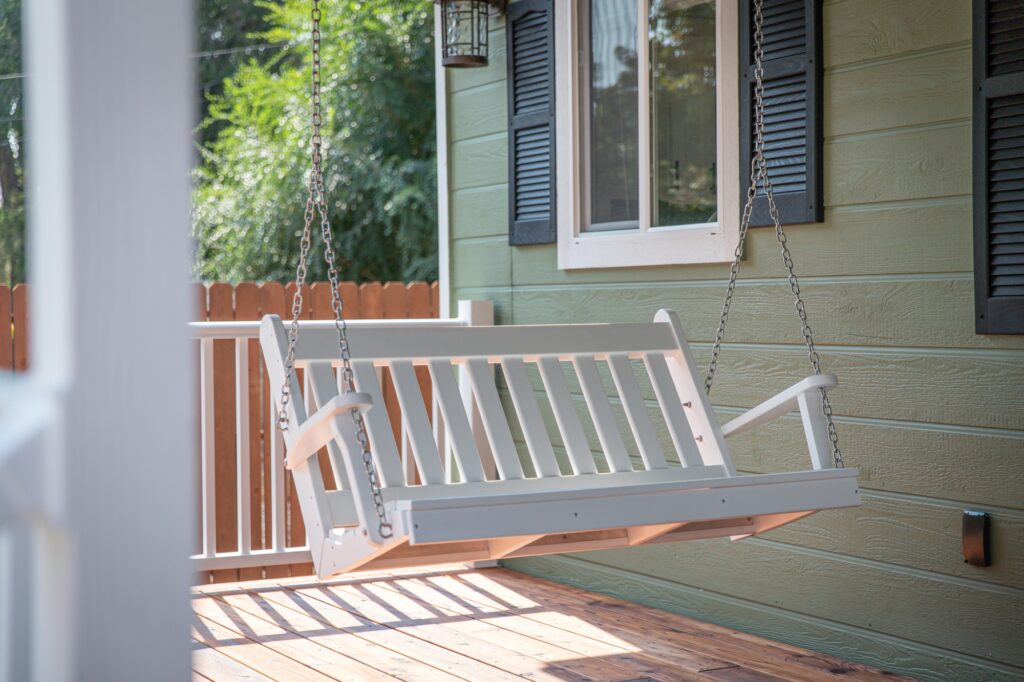 A bench swing at a home porch