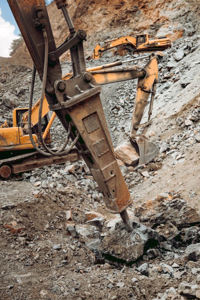 Hydraulic crusher excavator backhoe machinery working on site demolition