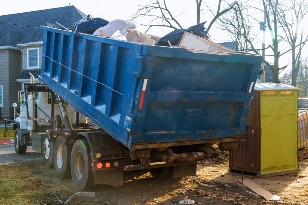 Removal of debris construction waste building demolition with rock and concrete rubble on portable